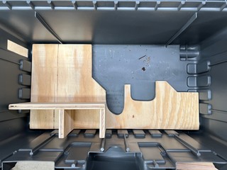 Cut out some scrap 1/2" plywood to secure the saw and accessories.