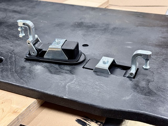 Installing latches. I had to cut the bracket down a bit to fit the plywood hatch