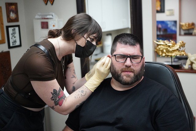 Gettin pierced by Bridget. Bridget was awesome.