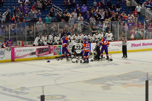 A whole team fight right in front of the visitors' bench, hahah. This game was wild