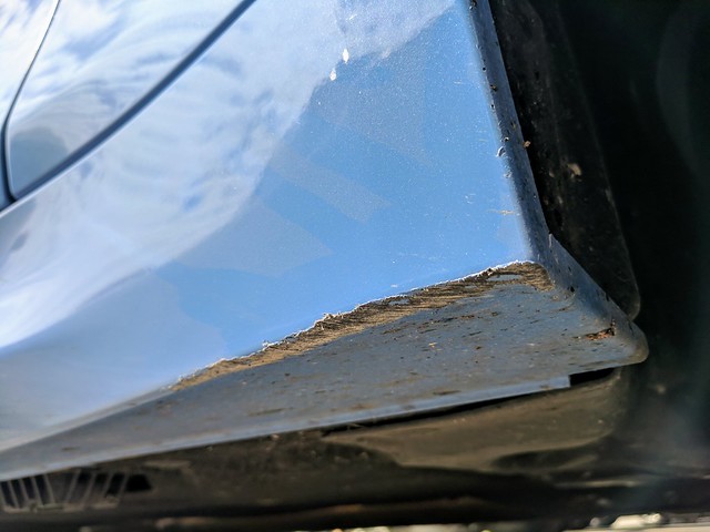 Nicked a curb trying to give this old farmer dude some room to navigate his truck at a gas statio...