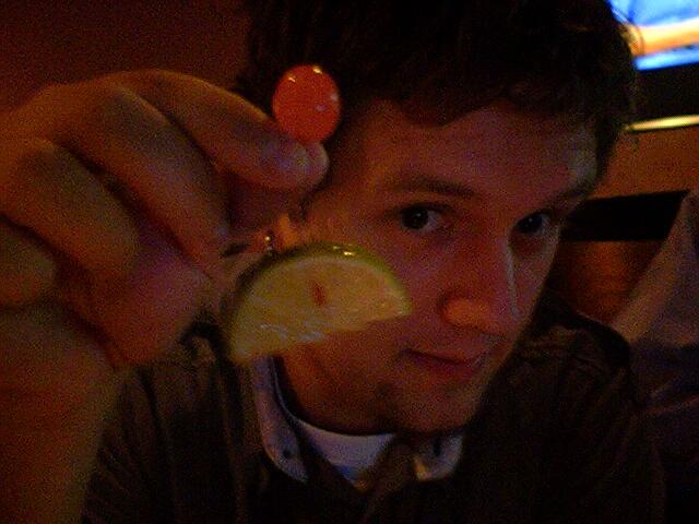 Cherry stuck through a lime.