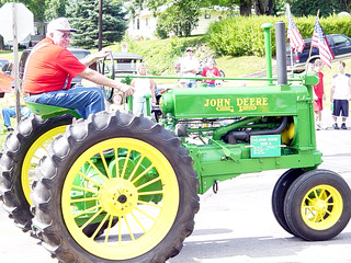 Morris driving a John Deere tractor