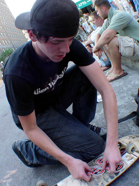Kyle putting Heelys stickers on his deck