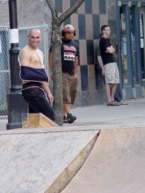 Dude skating with a sling on