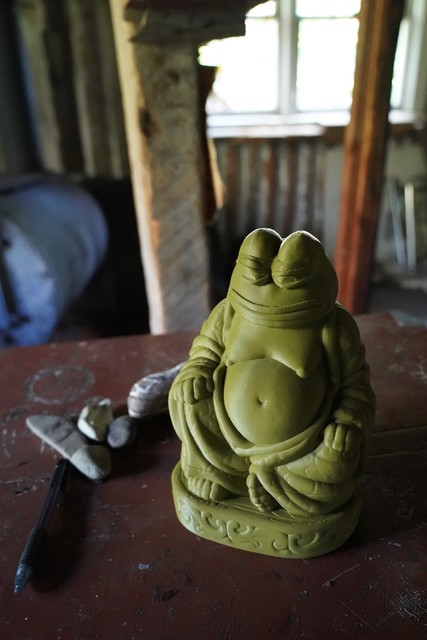 Someone left a 3D printed Fat Buddha Pepe in this cabin