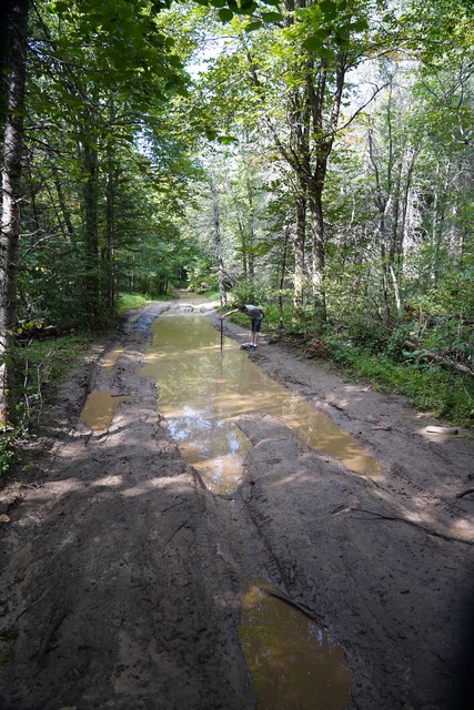 Jon checks the depth of this puddle