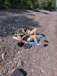 Some ladies chillin on this rocky beach