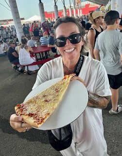 pizza - Dodgin the heat under the grandstands, eating a giant terrible slice of pizza from Bacci