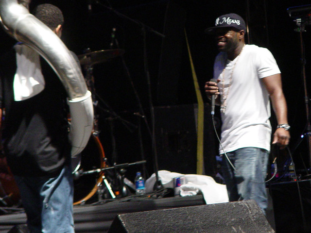 I like to think he's laughing about the dude having a tuba