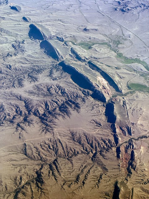 Some weird mountain and canyon formations flying over SE Wyoming