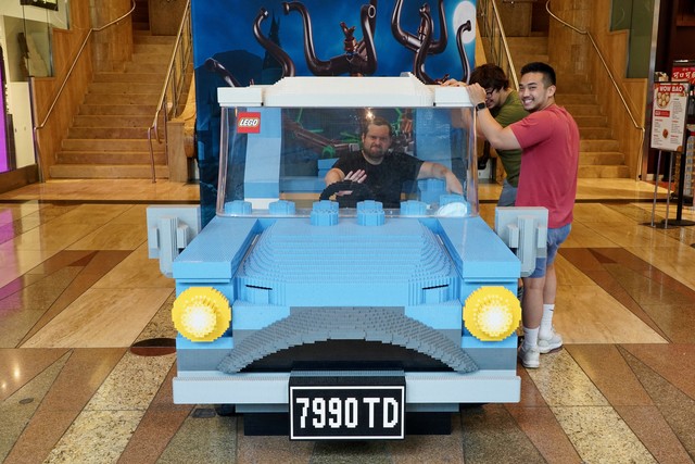 Angry man honks angrily in lego car