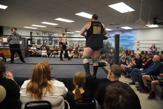 Jameson McGregor entering the ring with Kit Sackett
