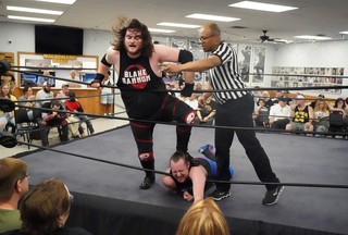 Blake Bannon standing on Kasady's neck