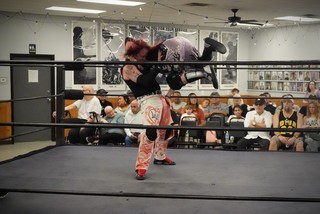 Yah Boy Andee flying at Adam Love