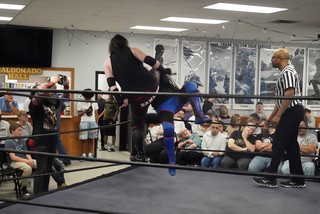 Kasady takes a knee to the face from Bannon