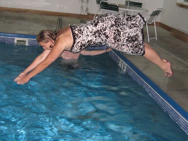 Tara diving in in her dress