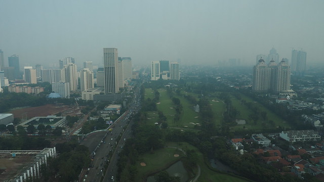 A smoggy view of Jakarta from the top of Hotel Mulia