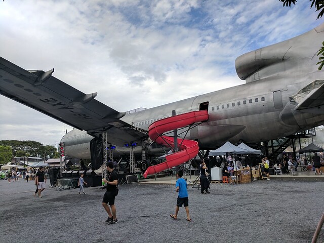 The market had an old airplane in the middle that was being converted into a restaurant.