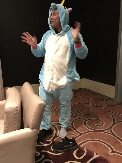 In the green room, we helped Krating get into this unicorn outfit in order to host this event