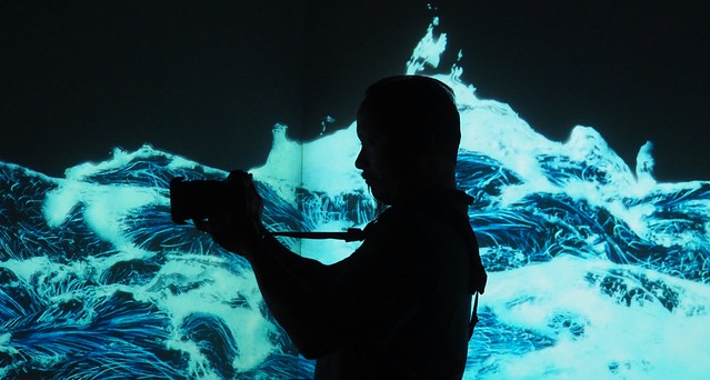 Ivan snapping photos in this rad digital ocean animation room