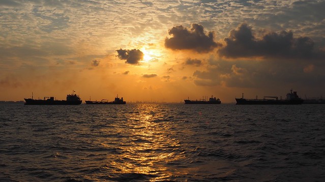 Tankers. Smog. Sunset.