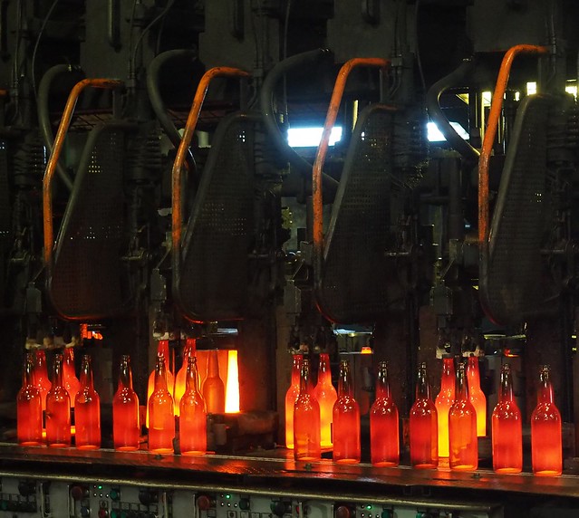 Molten hot, freshly formed bottles