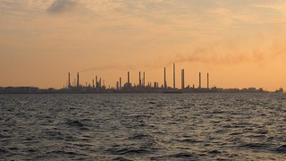 Sunset - Singapore factories silhouetted in a smoggy sunset