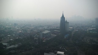 A smoggy view of Jakarta from the top of Hotel Mulia