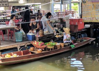 Selling produce at  the floating markets of Bangkok