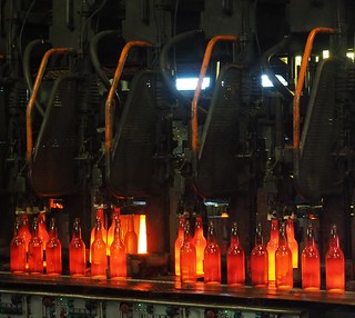 Molten hot, freshly formed bottles