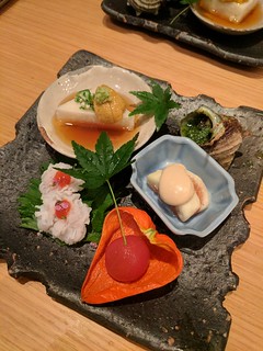 This course was a bunch of amazing little foods. That dude on the top right was conch served escargot style.
