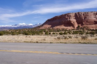 The Juxtaposition of the snowy La Sal mountains behind the red rock mesas is interesting