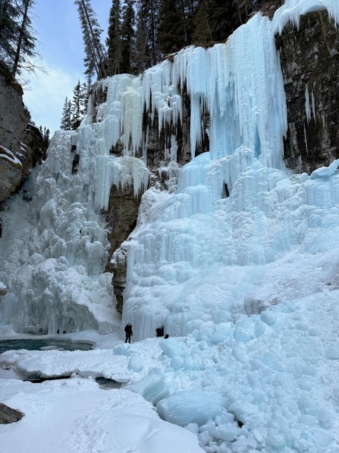 The upper falls at Johnston Canyon. Humans for scale