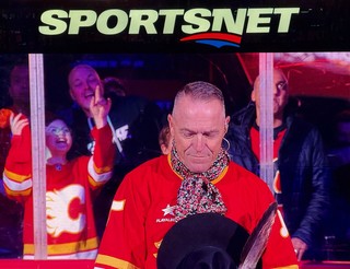 Hockey - This fancy man is about to sing the anthems