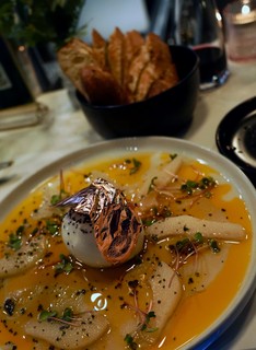 Some peach and pear burrata with gold on it