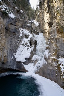 Snow - The lower falls at Johnston Canyon