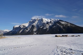 Snow - Lake Minnewanka. We were wishing that those buildings on the ice were open as a warming hut / pub
