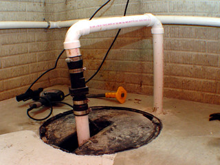 As I was mounting the other pipes to the wall - I decided I should fix these ugly sump pump pipes...