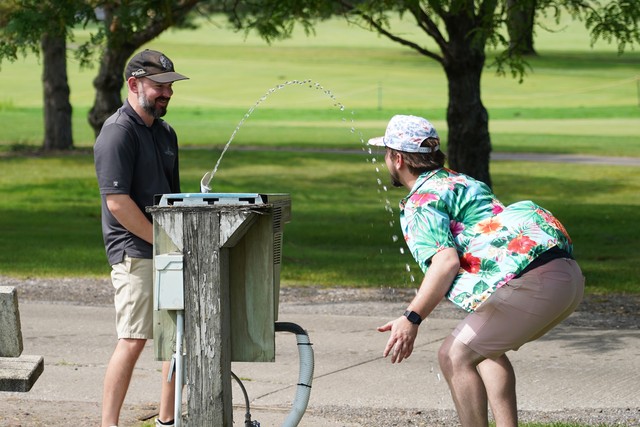 Helping Nick get a drink