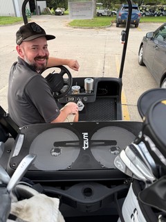 Tech - Carson brought a little Bluetooth speaker to golf today.