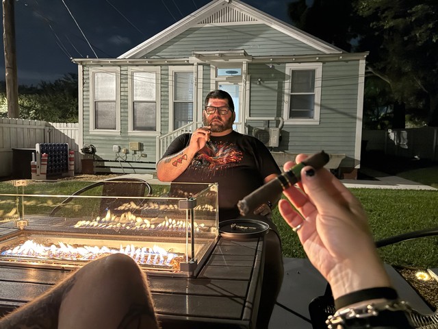 Cigar hangs in the back yard