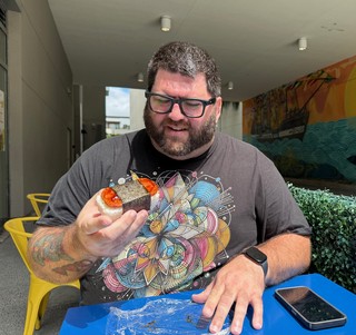 Travel - Kevi tries his first Spam Musubi