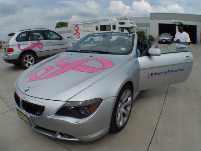 Nehru getting in the BMW 645i Convertible