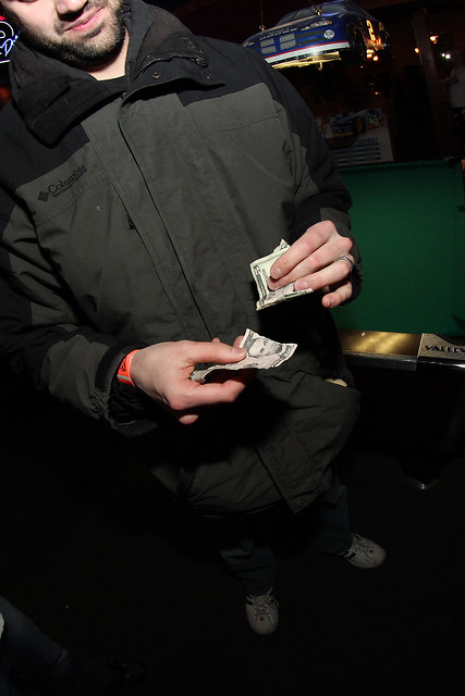 Josh showing Jeff how to play pull tabs