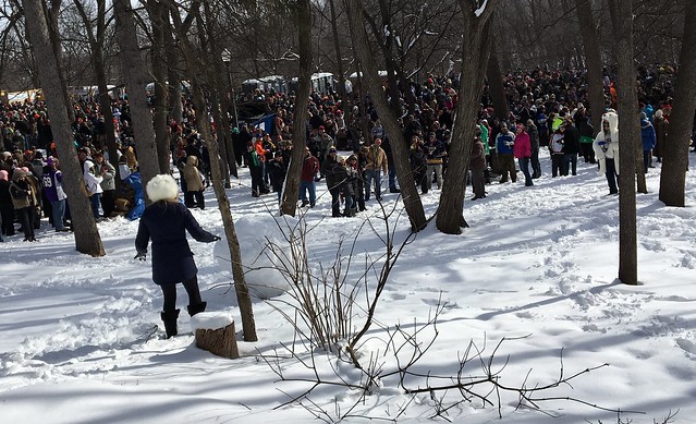 Katrina pushes the giant snowball into the crowd