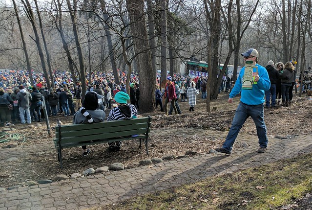 The crowd, some onlookers, and a dude with a massive stein