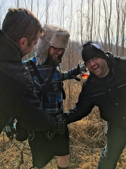 Kevi and Josh shake hands through my lederhosen pouch