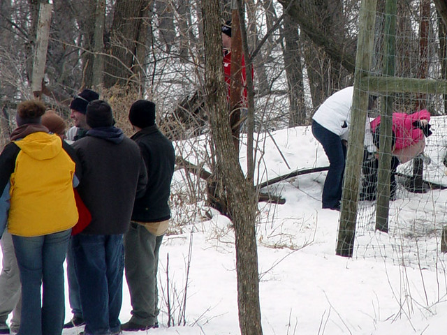 The dude in red is security.