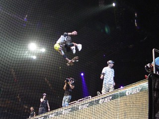 Andy Macdonald grabbing the deck after a flip trick